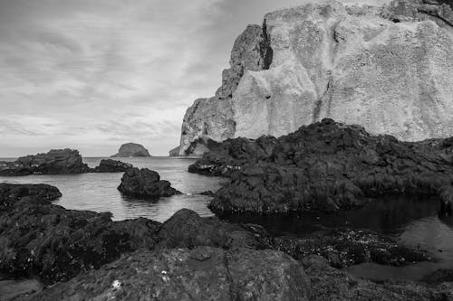 Greyscale Photo Of Rock Formations