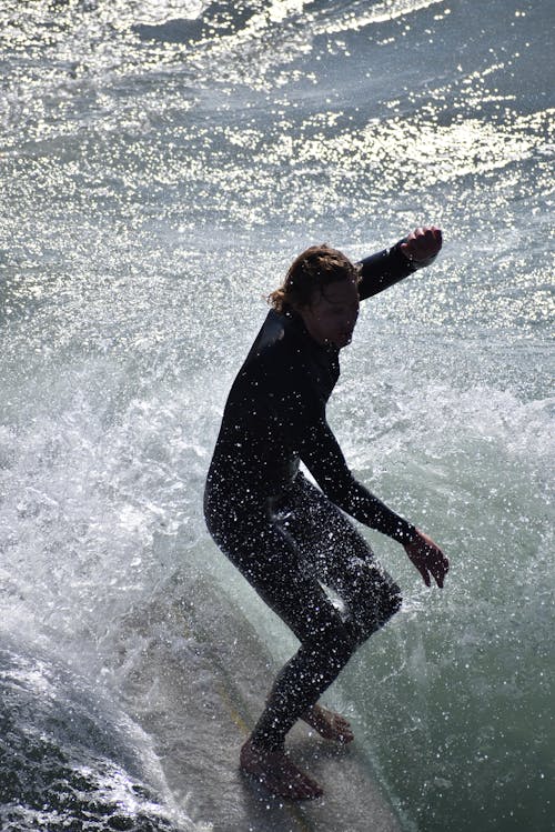 Man Surfing on the Waves