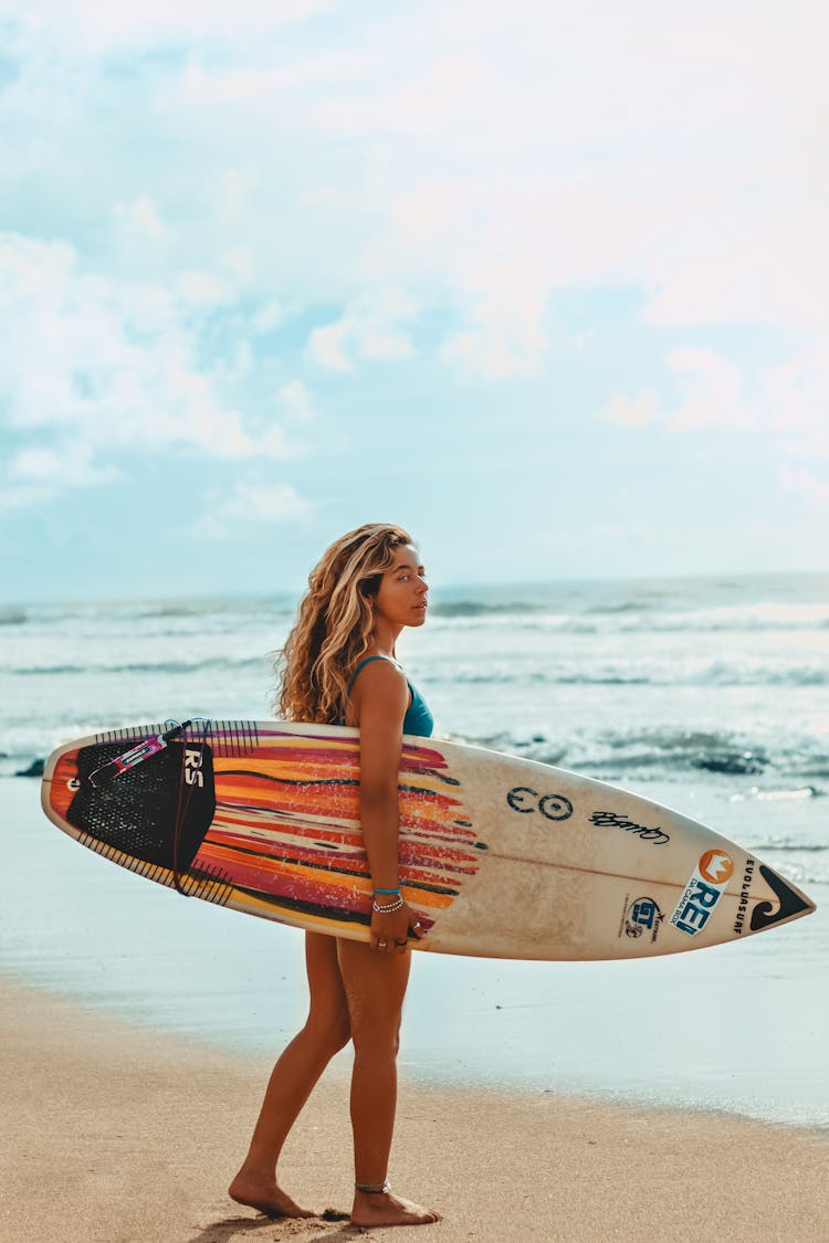 Blonde Woman Holding Surfboard