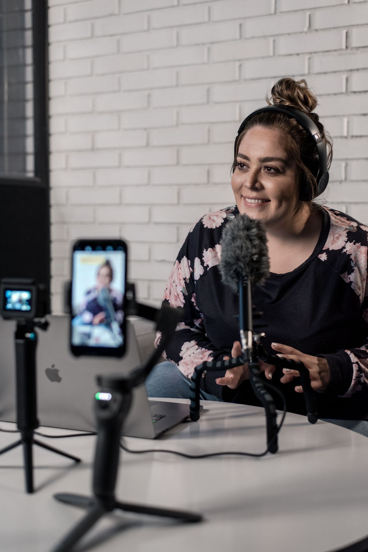 Presenter recording a live stream in a professional studio