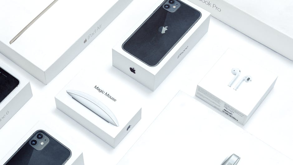 Flat lay of assorted Apple product boxes showcasing technology packaging design.