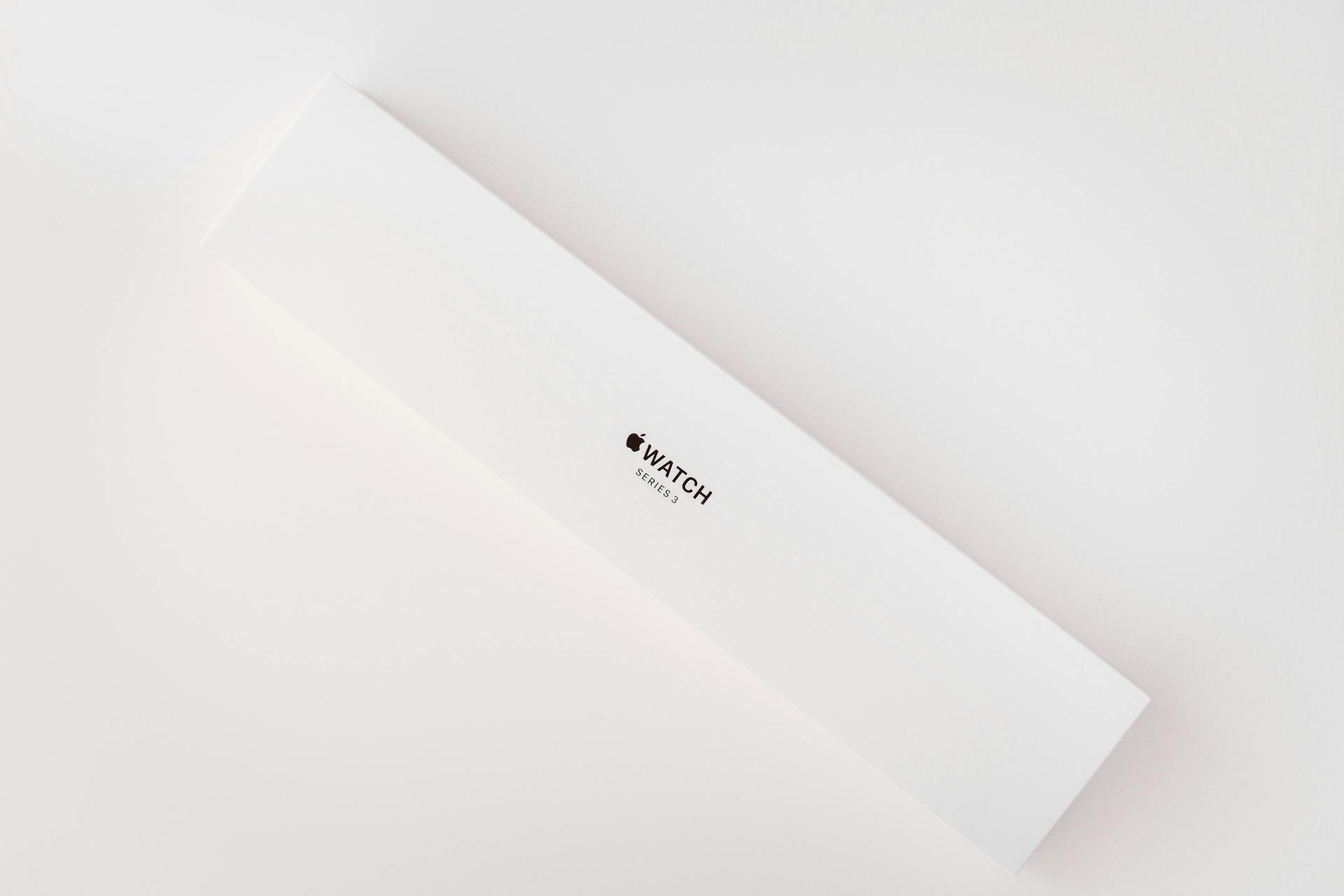 Sleek and minimalist Apple Watch box on a clean white background, emphasizing simplicity.