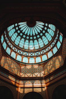 Stunning view of the Morisco Kiosk's glass dome with vibrant mosaic patterns in Mexico City.