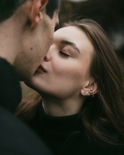 Woman and Man Kissing