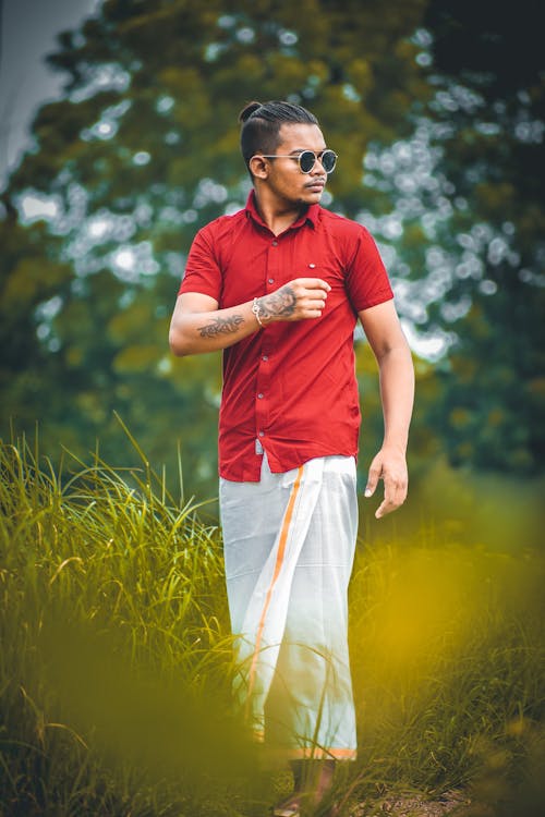 Man in Red Shirt and Traditional Clothing