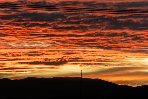 Free A breathtaking sunset with orange and pink clouds over hills in San Mateo Atarasquillo, Mexico. Stock Photo