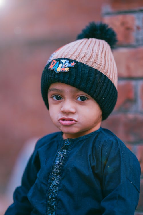 Boy in Blue Shirt Wearing Knit Hat