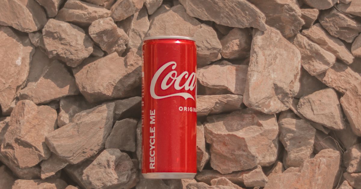 Cola Rocks Coca Cola Can on Brown Rocks · Free Stock Photo