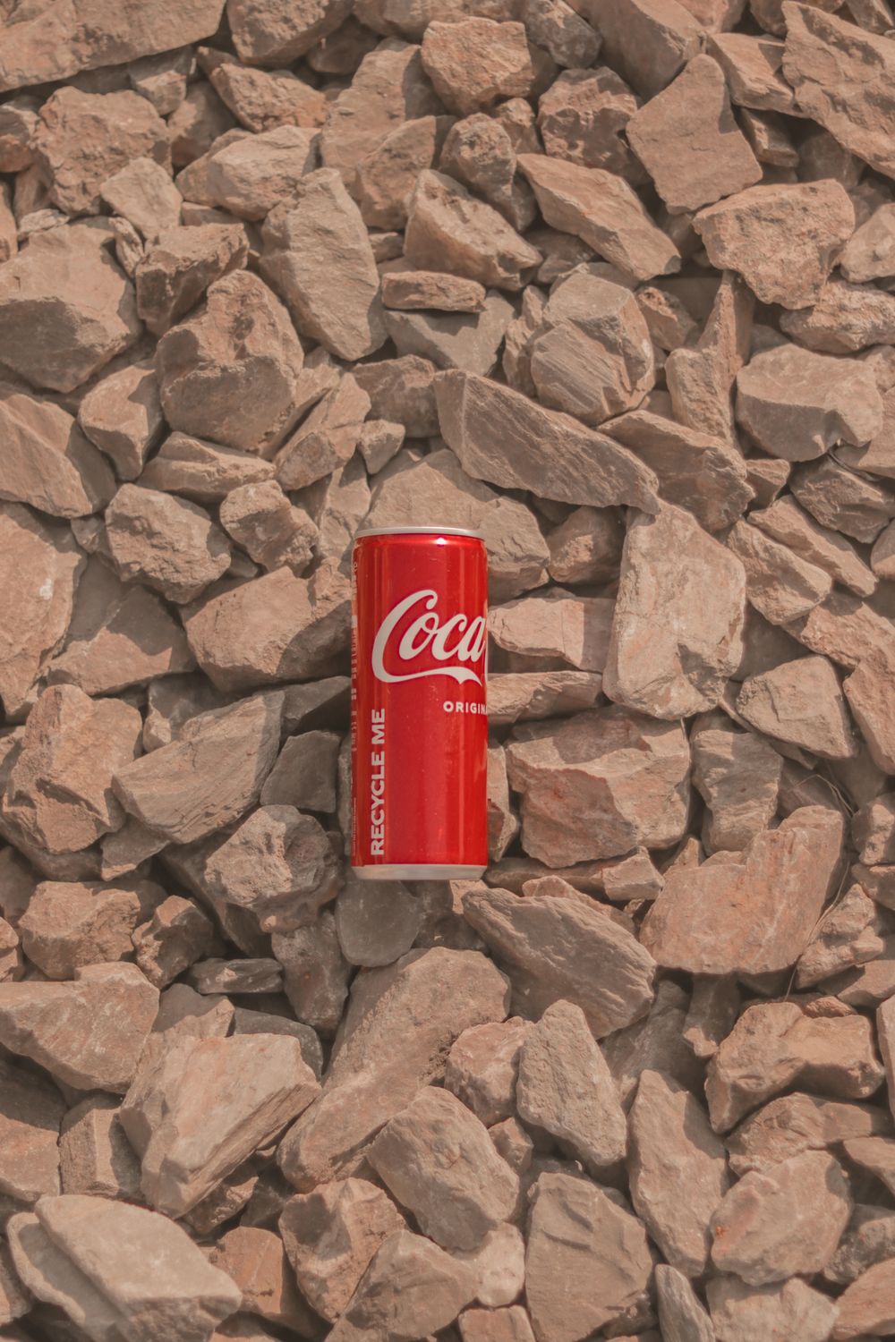 Cola Rocks Coca Cola Can on Brown Rocks · Free Stock Photo