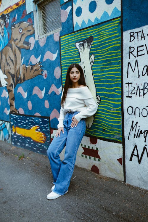 Brunette Woman Standing by Wall with Graffiti