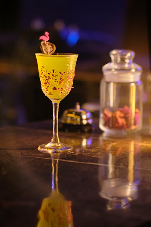 A Yellow Liquid on a Cocktail Glass