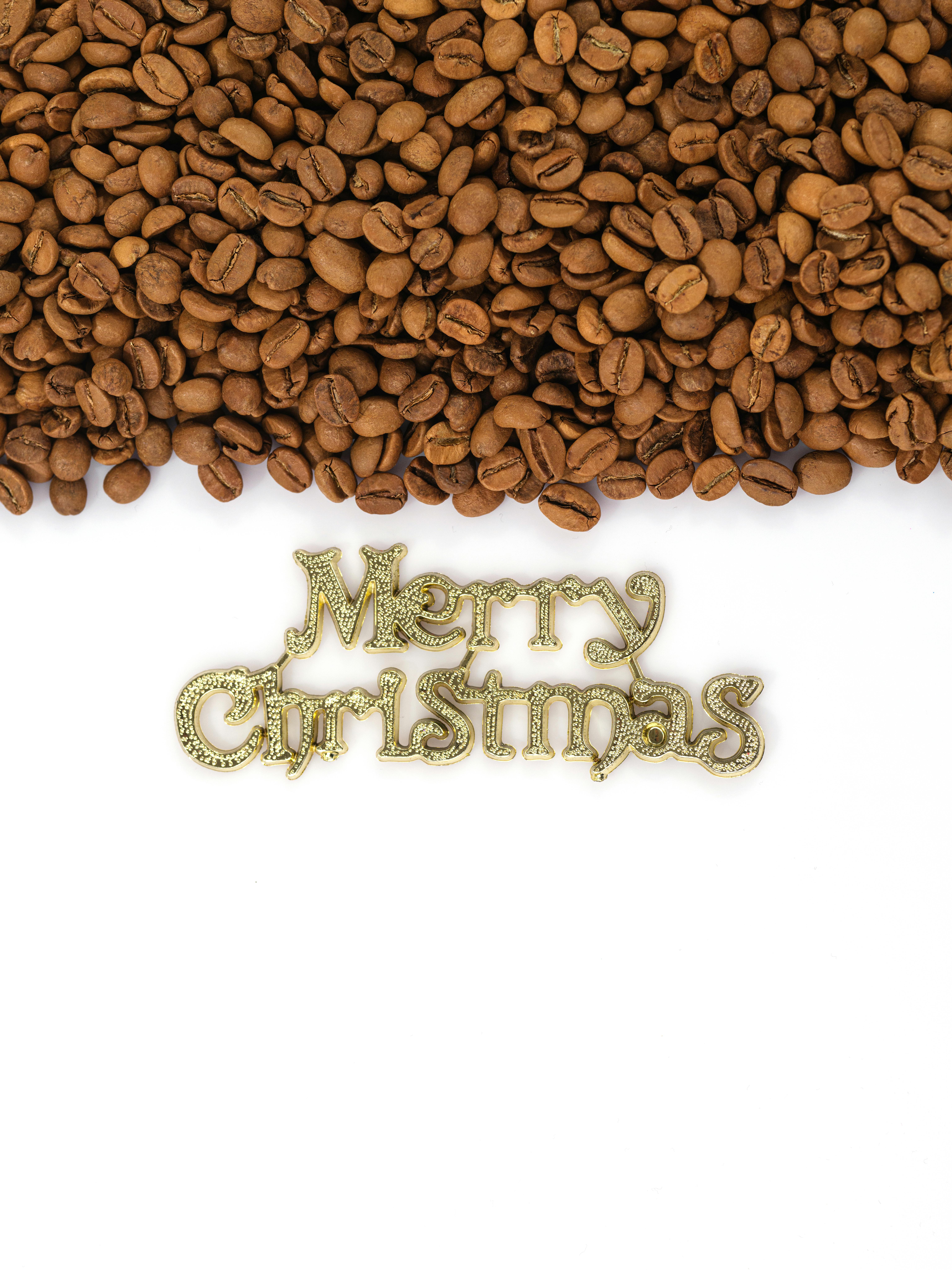 coffee beans over gold and gemstone merry christmas