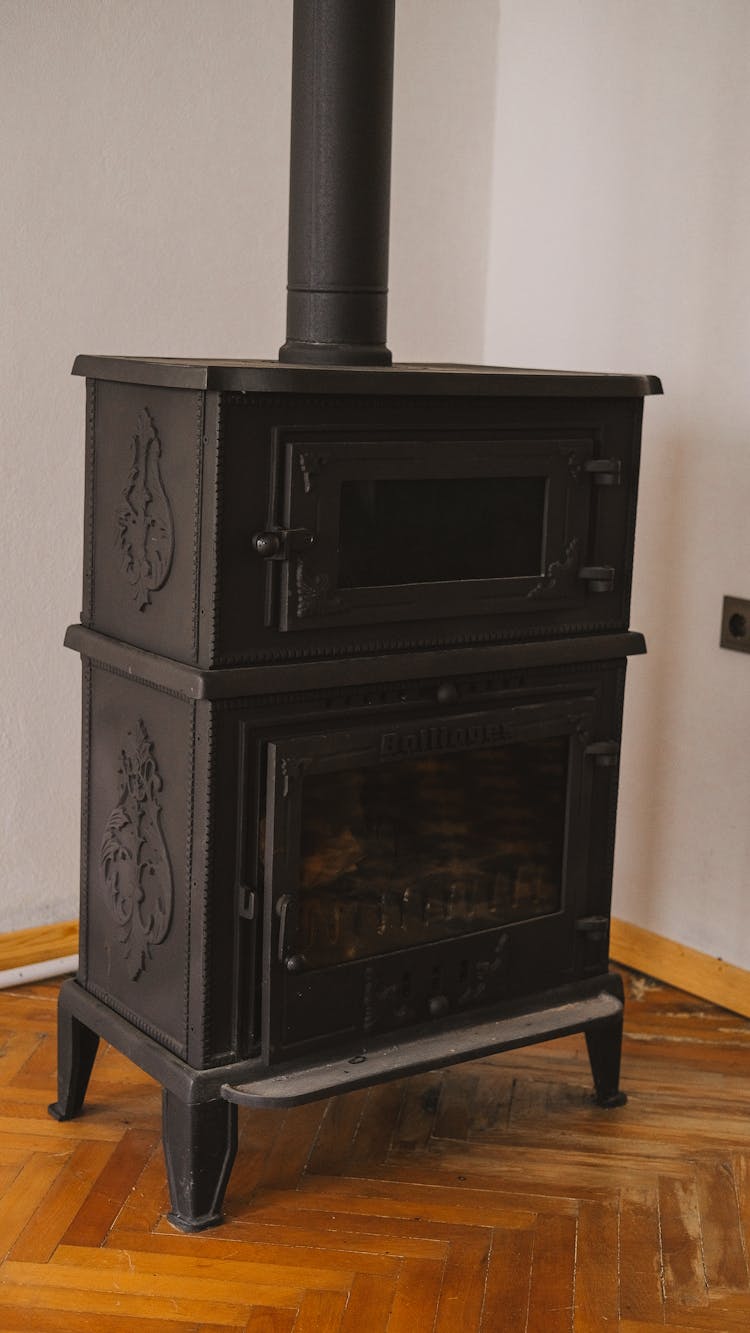 Black Metal Fireplace On A Wooden Floor