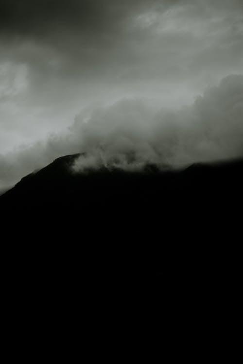 Black and White Photo of Fog in the Mountains