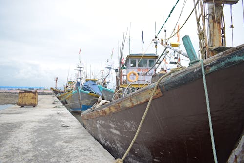 Rusty Fishing Boats in a Port 