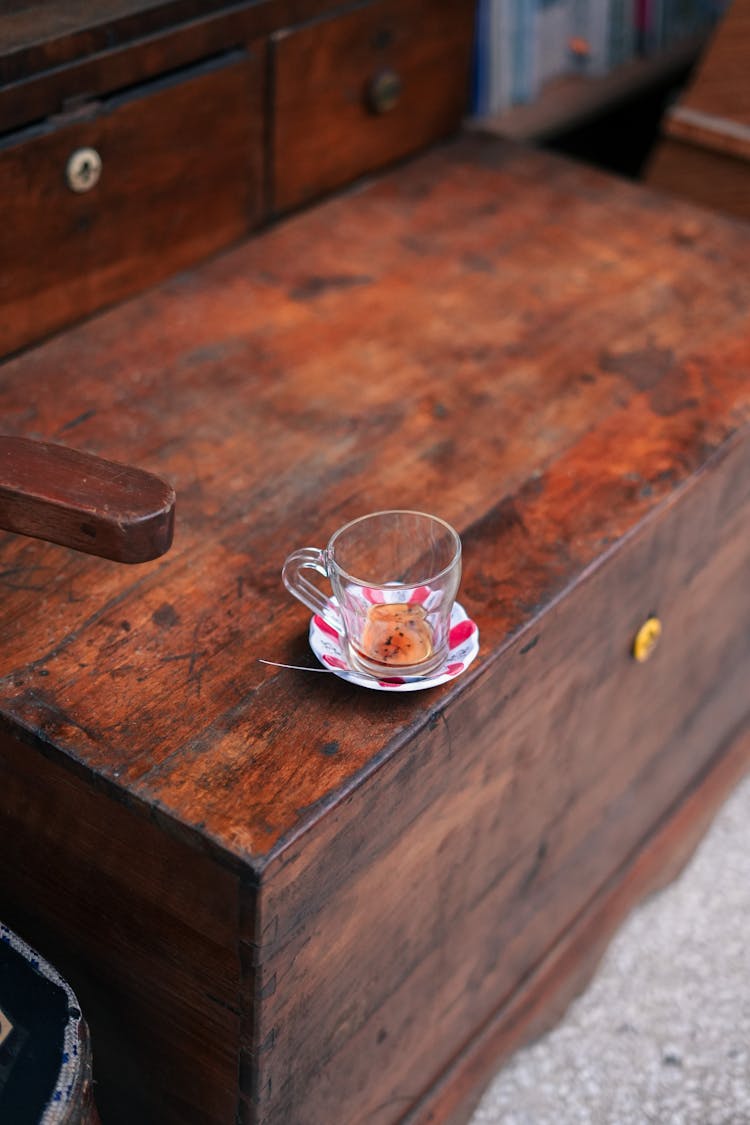 Empty Glass On A Wooden Piece Of Furniture 