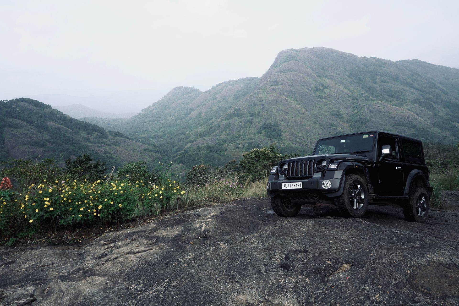 Black Jeep Parked Near Mountains