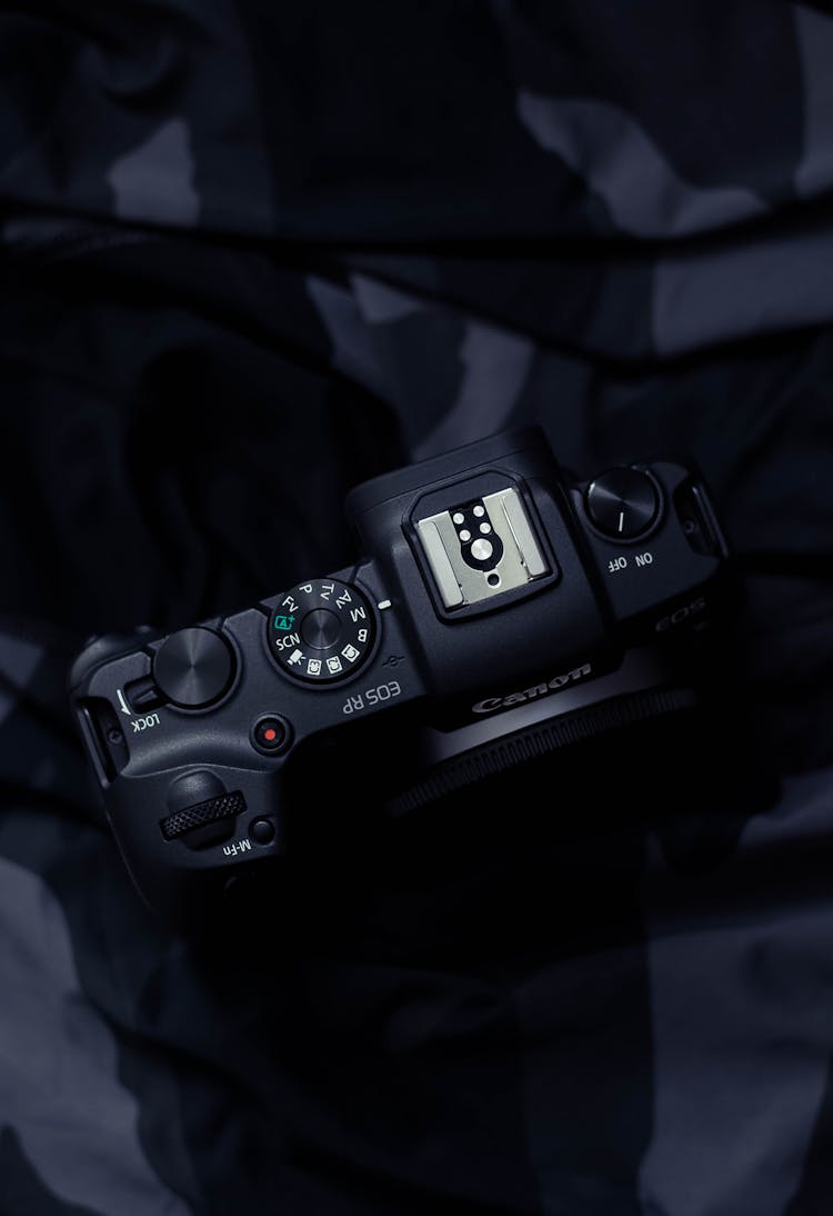 Black Dslr Camera On Black Textile