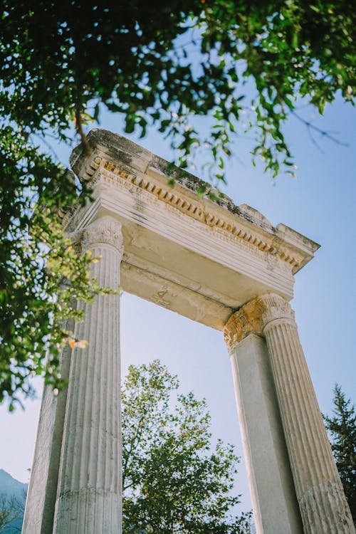 Ancient Arch with Columns against Blue Sky