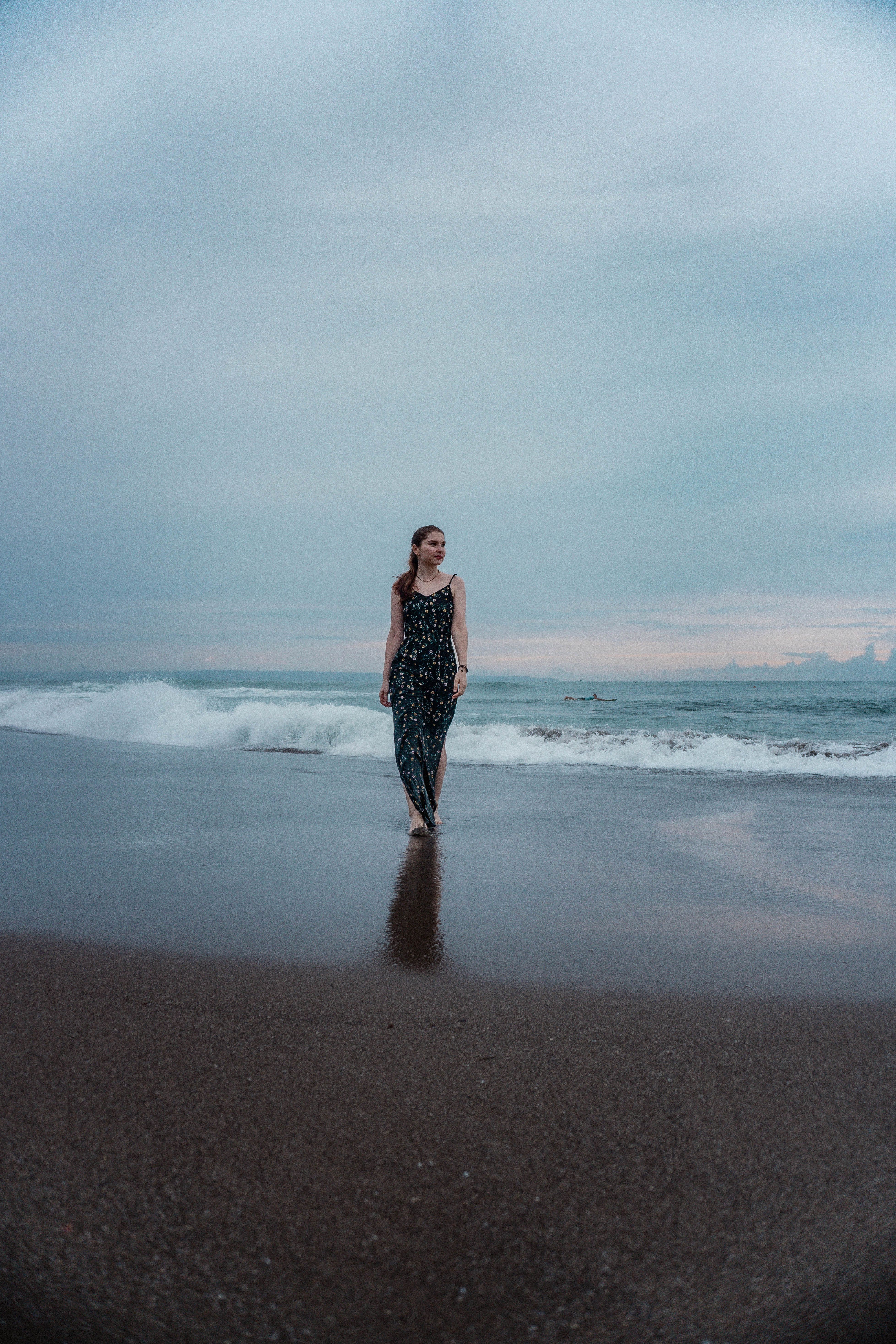 A Woman Wearing a Dress at the Beach · Free Stock Photo