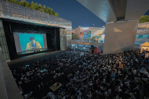 People Watching a Movie on a Festival 