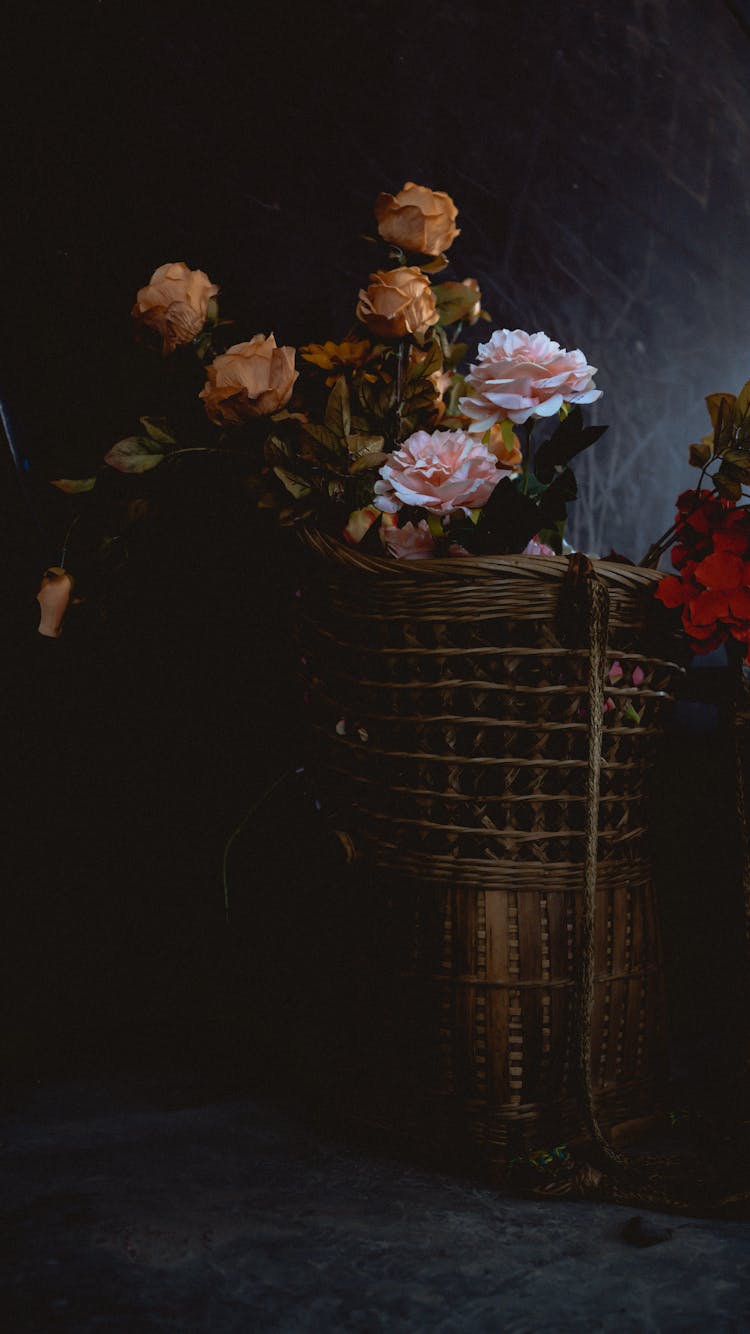 Flowers In Wicker Basket On Dark Background