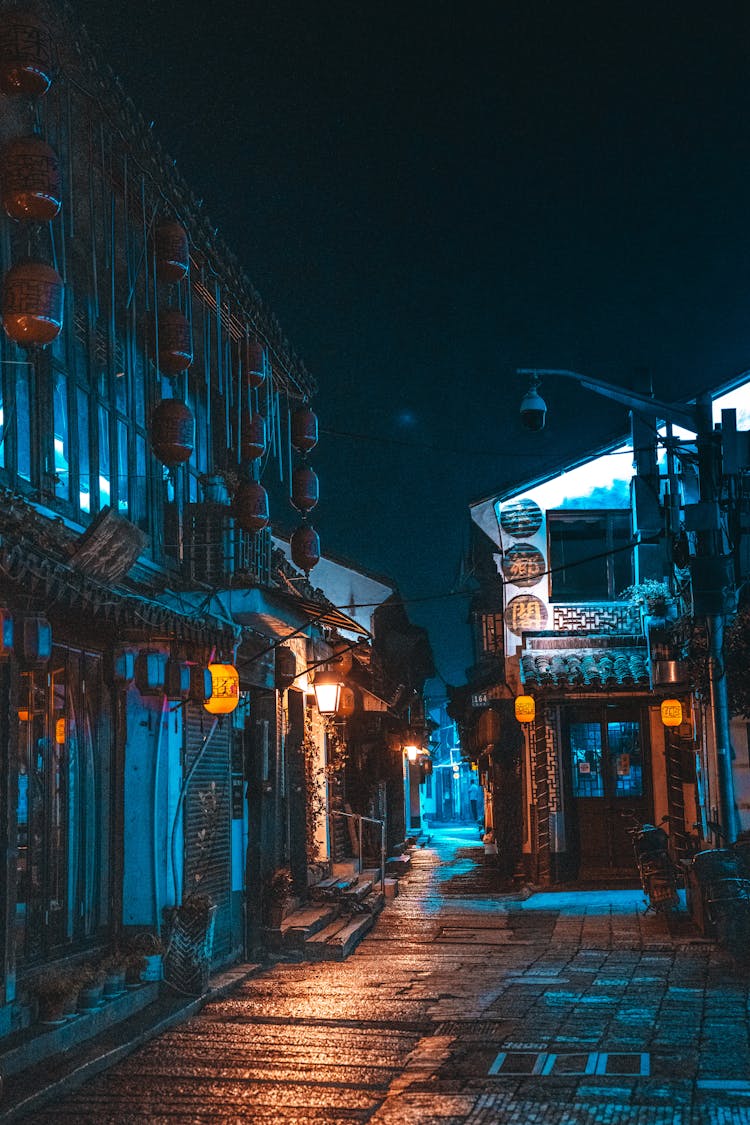 Photograph Of A Street During The Night