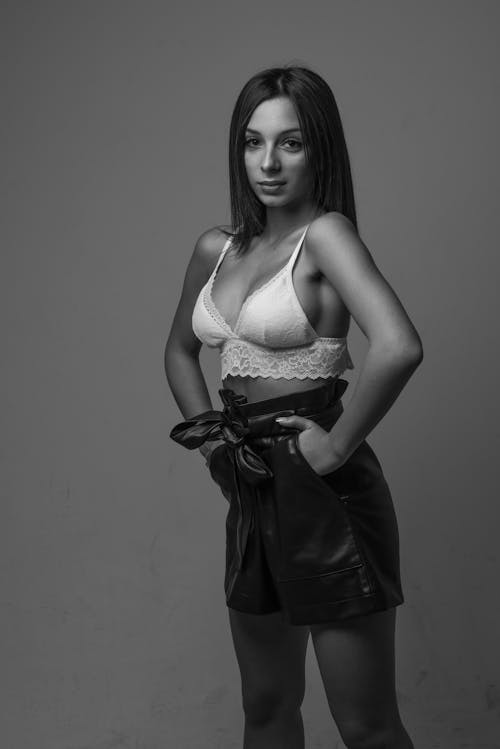 Grayscale Photo of a Woman in White Brassiere