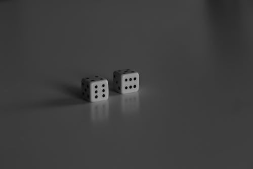 Two Dice on a Gray Surface