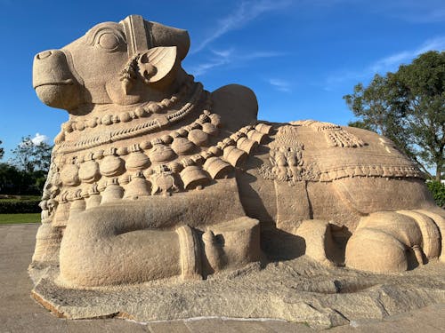 A Sculpture of a Seated Nandi Under the Blue Sky