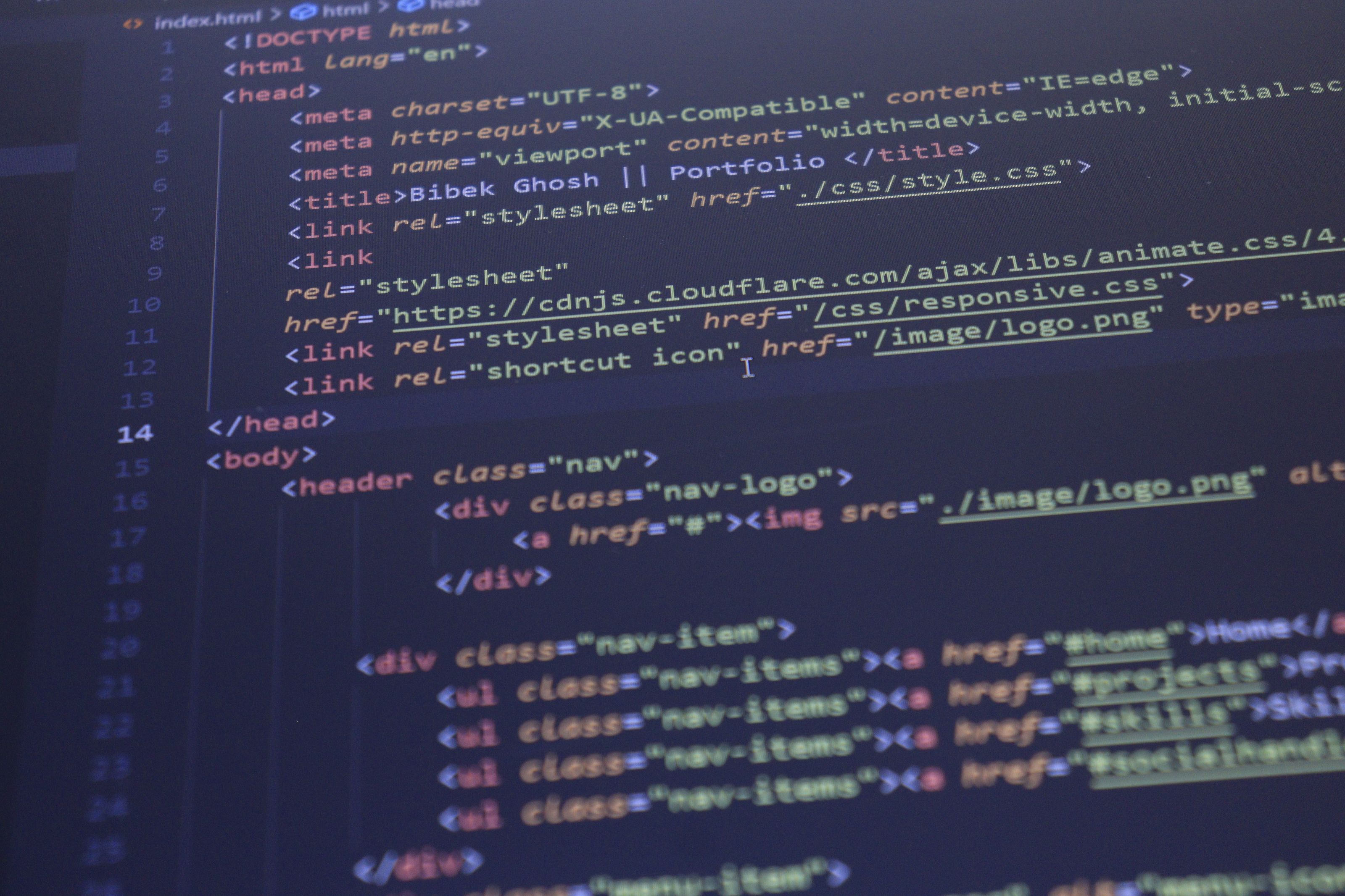 Close-up view of HTML and CSS code displayed on a computer screen, ideal for programming and technology themes.
