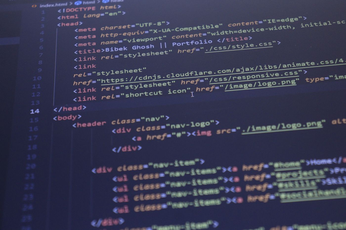 Close-up view of HTML and CSS code displayed on a computer screen, ideal for programming and technology themes.
