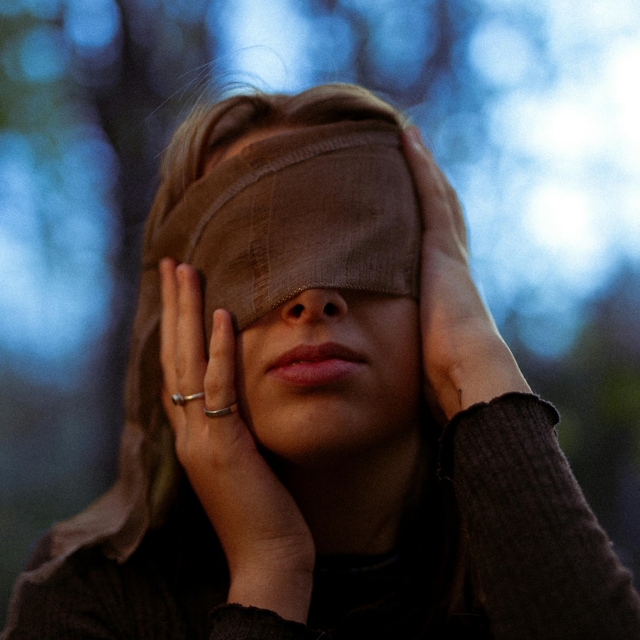 Blindfold woman with hands behind her back black and white - Stock Image -  Everypixel