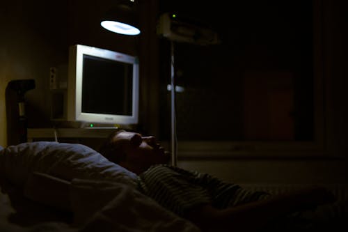 Man Lying on Bed in the Hospital