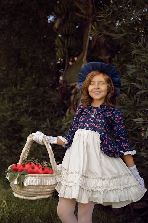 Young Girl carrying a Basket
