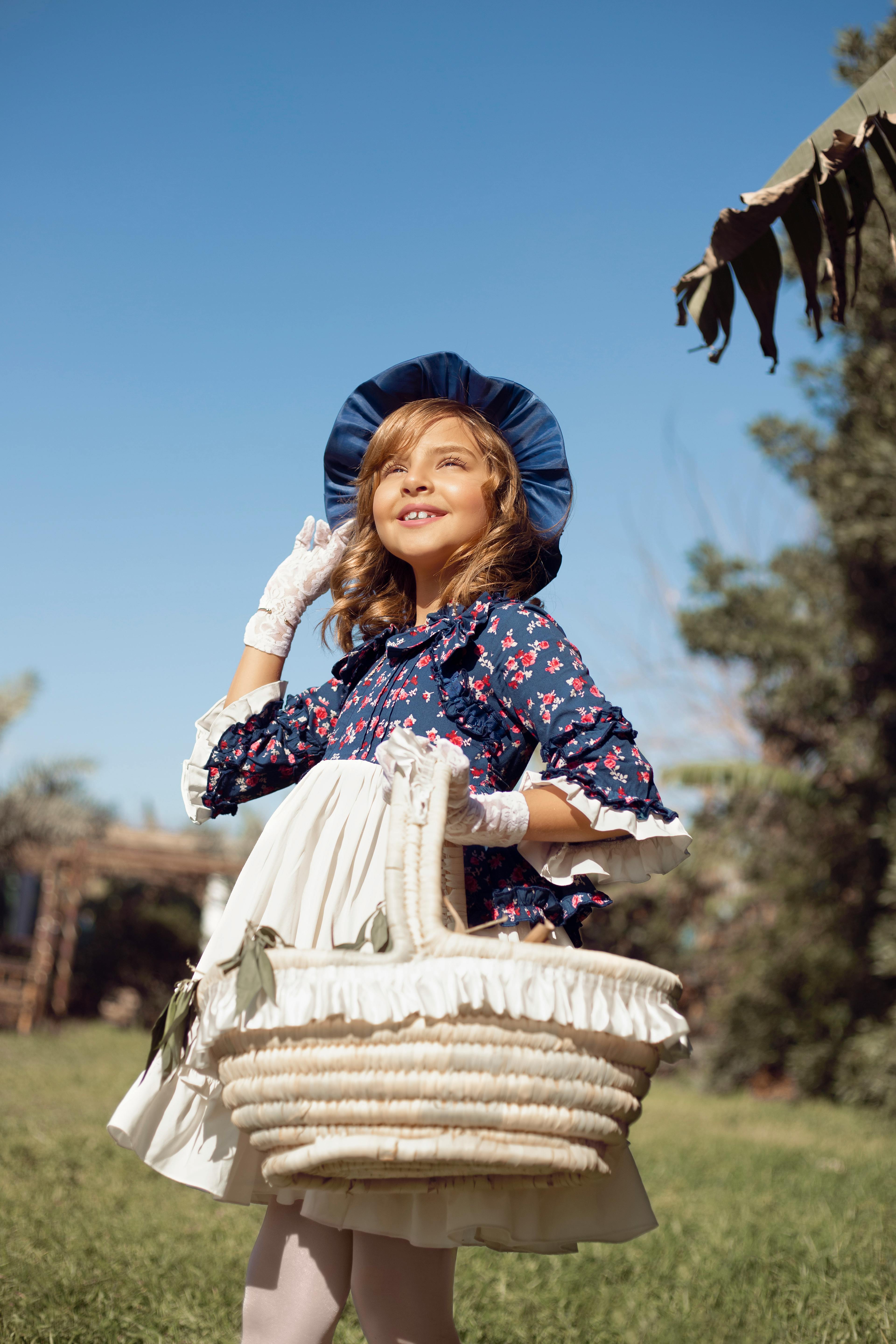 Photo of a Young Girl carrying a Basket · Free Stock Photo