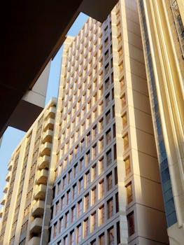 A vertical shot of modern buildings in Abu Dhabi showcasing geometric architecture and repetition in design.