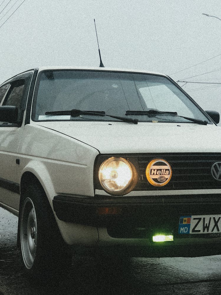 Closeup Of A White Car On A Road