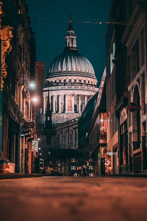 View of a Street and St Pauls Cathedral in London at Night, England, UK