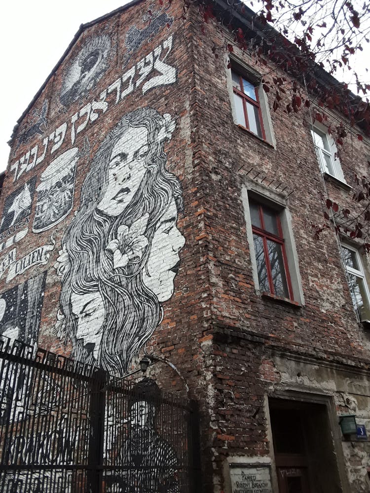 Mural Painting On The Wall Of A Brick Building