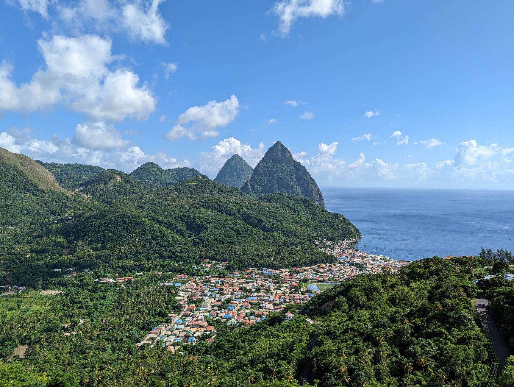 Stunning aerial view of Soufriere town and the iconic Pitons in Saint Lucia.. Photo by THARUN GOWDA on Pexels