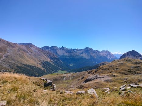 Explore the breathtaking landscape of Poschiavo with this stunning mountain scenery.