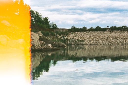Photo of a Pond with a Rocky Shore