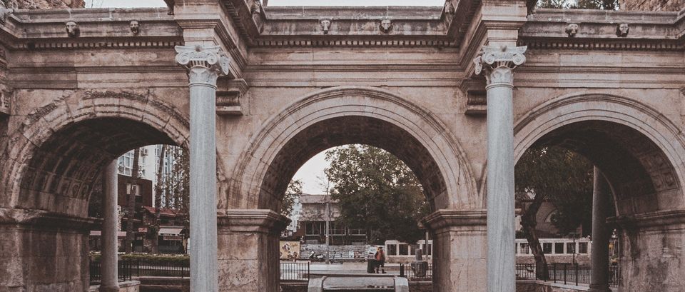 Explore an iconic Roman arch with classic columns in an urban cityscape., Antalya, Turkey, stay connected here with a travel eSIM