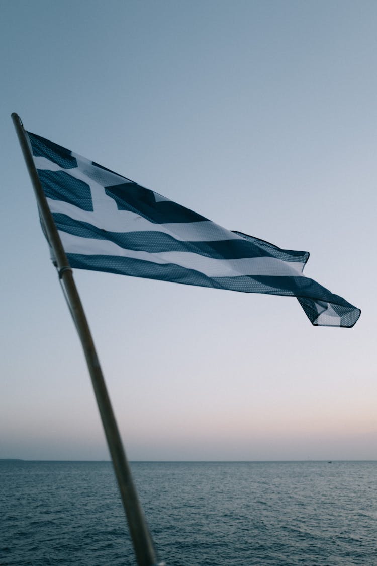 Greece Flag On Water Background