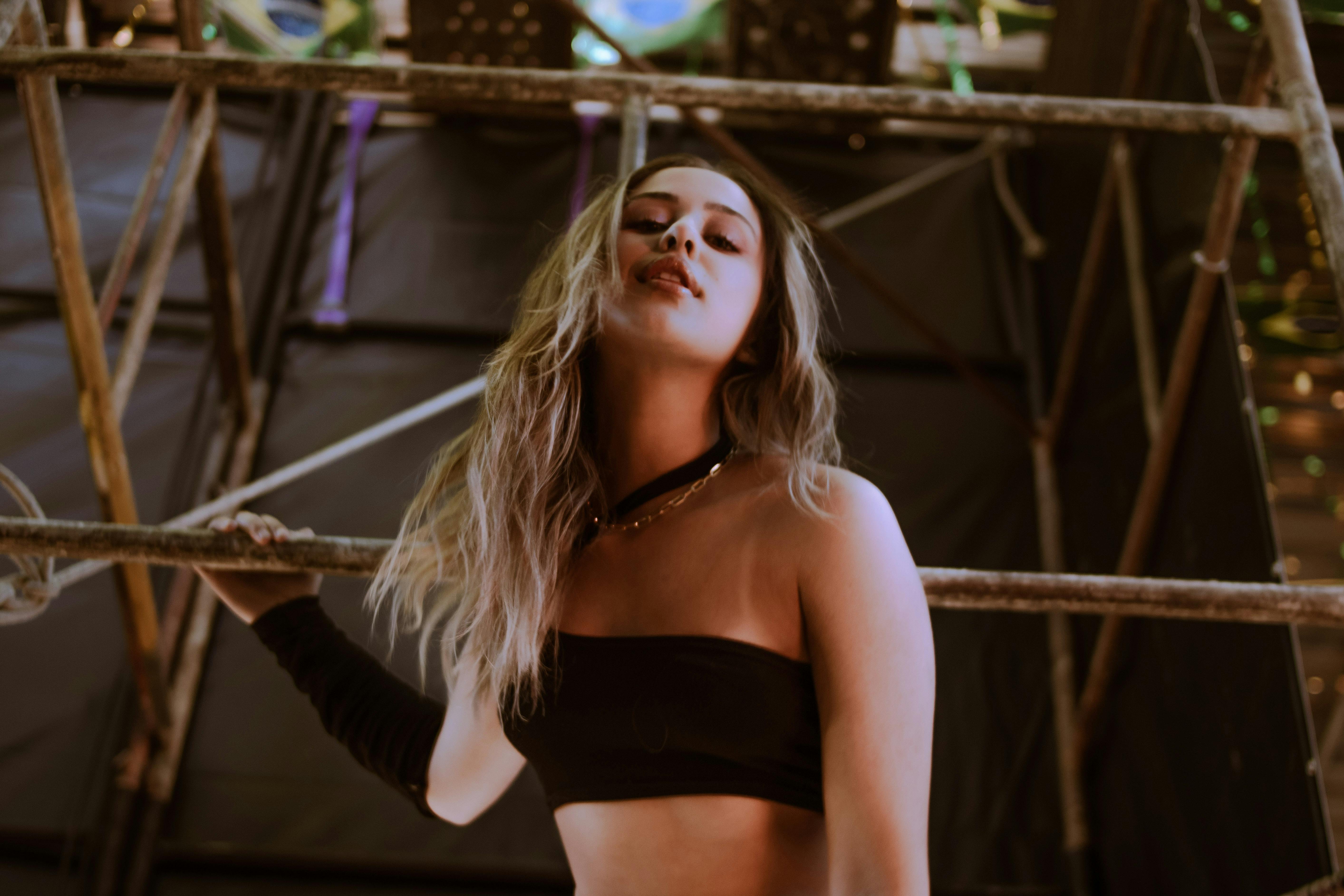 Low-Angle Shot of a Blonde Woman Wearing Black Tube Top · Free Stock Photo