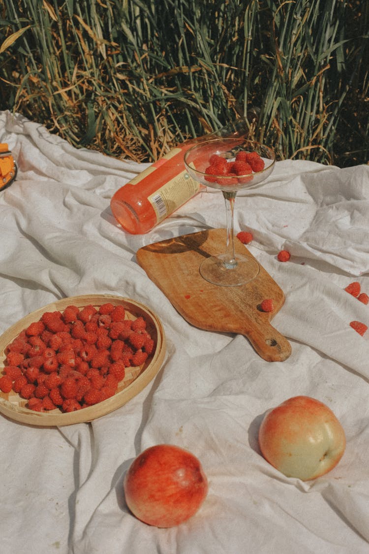 Apples And Rasberries On Blanket