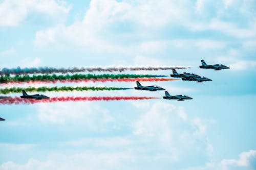 View of an Airshow with Planes Leaving Colorful Trails Behind 