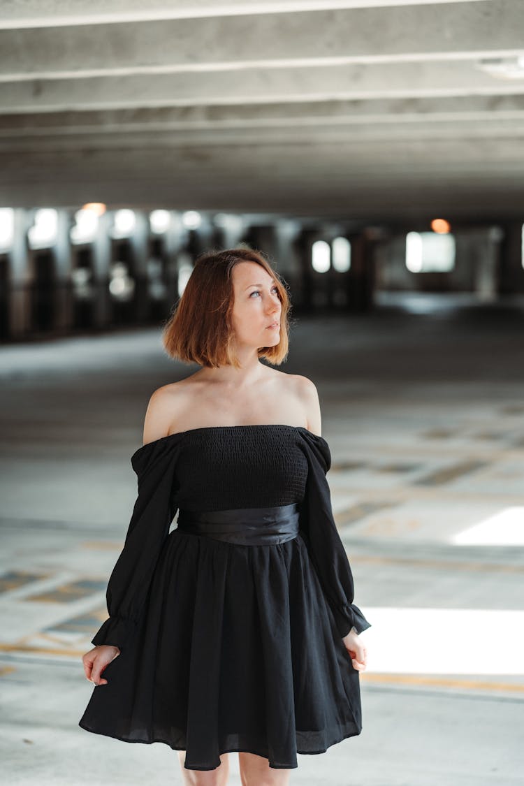 Woman In Off Shoulder Black Dress