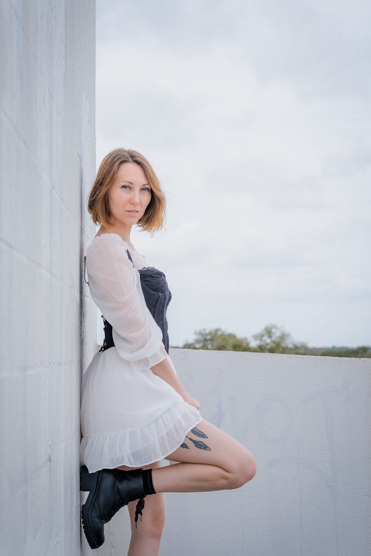 Woman Leaning On A Wall